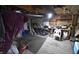 Spacious garage with ample storage space, tools, and a purple bicycle at 2638 S Mcclure St, Indianapolis, IN 46241