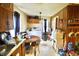 Practical kitchen with wood cabinets, appliances, and a dining area providing everything needed for meal prep and dining at 2638 S Mcclure St, Indianapolis, IN 46241