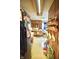 Functional kitchen with wood cabinets, appliances, and a dining area, offering a practical space at 2638 S Mcclure St, Indianapolis, IN 46241
