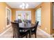 Comfortable dining room showcasing natural light and a modern chandelier at 2756 Bluebell E Ct, Columbus, IN 47201