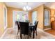 Warm dining area filled with natural light and comfortable seating for four at 2756 Bluebell E Ct, Columbus, IN 47201