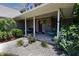 Welcoming front porch with comfortable seating, landscaping, and a charming entrance, perfect for relaxation at 2756 Bluebell E Ct, Columbus, IN 47201