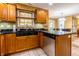 Functional kitchen area with stone counters and stainless steel dishwasher at 2756 Bluebell E Ct, Columbus, IN 47201