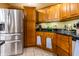 Well-equipped kitchen featuring stainless steel appliances and rich wooden cabinetry at 2756 Bluebell E Ct, Columbus, IN 47201