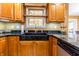 Charming kitchen with a unique dark sink and plenty of natural light at 2756 Bluebell E Ct, Columbus, IN 47201