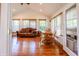 Bright sunroom featuring a comfortable sofa and dining area with abundant natural light at 2756 Bluebell E Ct, Columbus, IN 47201