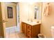 Well-lit powder room with vanity, mirror, and framed artwork at 2756 Bluebell E Ct, Columbus, IN 47201