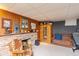 Cozy basement space with brick fireplace, sauna, and comfortable seating area, perfect for relaxation at 2808 Woodside Dr, Plainfield, IN 46168