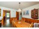 Traditional dining area with wood paneling and unique pendant lighting at 2808 Woodside Dr, Plainfield, IN 46168