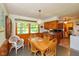 Bright dining area featuring wood table, chair, and window with a view at 2808 Woodside Dr, Plainfield, IN 46168