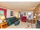 Spacious living room featuring a stone fireplace and traditional decor at 2808 Woodside Dr, Plainfield, IN 46168