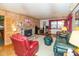 Comfortable living room with wood paneling and cozy stone fireplace at 2808 Woodside Dr, Plainfield, IN 46168