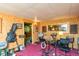 Basement music room setup with instruments, recording equipment, and natural light from the interior window at 2808 Woodside Dr, Plainfield, IN 46168