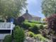 Scenic backyard with stone steps leading up to the house at 3154 Beach Blvd, Cicero, IN 46034
