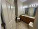 Bathroom with double sinks, wood cabinets, and tile floor providing ample space at 3154 Beach Blvd, Cicero, IN 46034
