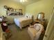 Charming bedroom featuring a cozy armchair, a decorative vanity and doll display at 3154 Beach Blvd, Cicero, IN 46034