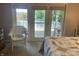 Bedroom with a patio door leading to a deck with views of the trees at 3154 Beach Blvd, Cicero, IN 46034