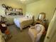Charming bedroom featuring a cozy armchair, a decorative vanity and doll display at 3154 Beach Blvd, Cicero, IN 46034