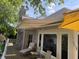 Enjoy outdoor living with this deck featuring an awning, providing shade and comfort while overlooking the home's exterior at 3154 Beach Blvd, Cicero, IN 46034