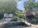 Beautiful exterior view of home with lush landscaping, a bridge, and water access for serene lake living at 3154 Beach Blvd, Cicero, IN 46034