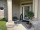 Cozy covered front porch with detailed decor and nice landscaping at 3154 Beach Blvd, Cicero, IN 46034