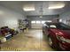 Spacious two-car garage with ample storage and a red car inside at 3154 Beach Blvd, Cicero, IN 46034