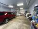 View of the spacious three car garage with high ceilings and built in storage at 3154 Beach Blvd, Cicero, IN 46034