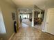 The expansive living area connects seamlessly with the dining room, all under high ceilings and neutral wall and floor coverings at 3154 Beach Blvd, Cicero, IN 46034