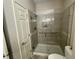 Modern bathroom shower with glass door, grab bar, and tiled walls at 3154 Beach Blvd, Cicero, IN 46034