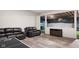 Finished basement with leather furniture, wood cabinets, and an indoor batting cage at 320 Briar Hill Dr, Whiteland, IN 46184