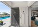 Bathroom with a pool view, unique doors, and a modern design with convenient access to outdoor amenities at 320 Briar Hill Dr, Whiteland, IN 46184