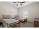 Cozy bedroom featuring two twin beds with soft linens and a neutral color palette at 320 Briar Hill Dr, Whiteland, IN 46184