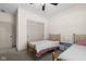Comfortable bedroom featuring two twin beds, a window, and ample closet space at 320 Briar Hill Dr, Whiteland, IN 46184
