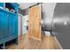 Hallway features a unique sliding barn door, coat rack, and stairs at 320 Briar Hill Dr, Whiteland, IN 46184