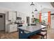 Well-lit kitchen featuring a large island with granite countertops, stainless steel appliances, and ample storage at 320 Briar Hill Dr, Whiteland, IN 46184