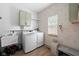 Laundry room featuring modern washer and dryer, ample counter space, and bright natural light at 320 Briar Hill Dr, Whiteland, IN 46184