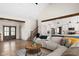 Spacious living area with a staircase, views into the kitchen and hardwood floors at 320 Briar Hill Dr, Whiteland, IN 46184
