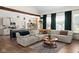 Bright, open living room featuring a sectional sofa and an open kitchen, perfect for modern living at 320 Briar Hill Dr, Whiteland, IN 46184