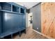Welcoming mudroom featuring custom built-ins and a rustic sliding barn door entry to the house at 320 Briar Hill Dr, Whiteland, IN 46184
