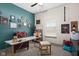 A modern office space with a large window, a marble top desk, and stylish decor elements at 320 Briar Hill Dr, Whiteland, IN 46184