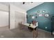 Well-lit office space featuring a marble-topped desk, bright accent wall and modern decorations at 320 Briar Hill Dr, Whiteland, IN 46184