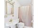 Bathroom with a white pedestal sink, toilet and shower with tan curtain at 328 Marine Dr, Anderson, IN 46016
