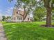 Charming two-story home featuring a well-manicured lawn, mature trees and classic architectural details at 328 Marine Dr, Anderson, IN 46016