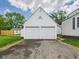 Detached two-car garage with a clean white exterior and an asphalt driveway, conveniently located at 328 Marine Dr, Anderson, IN 46016