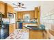 Functional kitchen featuring wooden cabinets, updated appliances, and a view into the dining area at 328 Marine Dr, Anderson, IN 46016