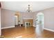 Spacious living room with hardwood floors, a brick fireplace, and arched doorways leading to other rooms at 328 Marine Dr, Anderson, IN 46016