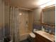 Bathroom featuring a vanity, shower-tub combination, and dolphin wallpaper border at 3310 W State Road 58, Seymour, IN 47274