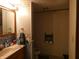 Bathroom featuring a wood vanity, dolphin wallpaper border, and water closet at 3310 W State Road 58, Seymour, IN 47274