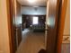 View from the hallway looking into the bedroom with neutral carpet and decor at 3310 W State Road 58, Seymour, IN 47274