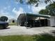 Multi-car carport with ample storage and room to park vehicles and equipment at 3310 W State Road 58, Seymour, IN 47274